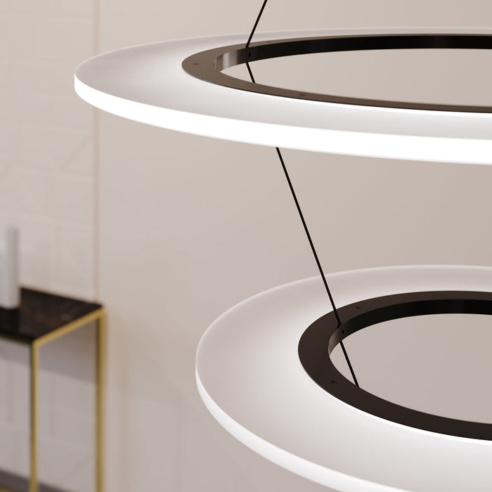 Arctic Rings™ Triple Ring LED Pendant Light in living room.