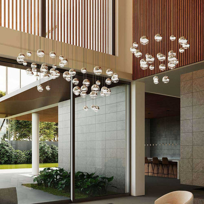 Grapes® 24-Light Round LED Multipoint Pendant Light in living room.