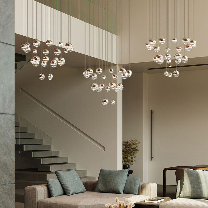 Grapes® 24-Light Round LED Multipoint Pendant Light in living room.