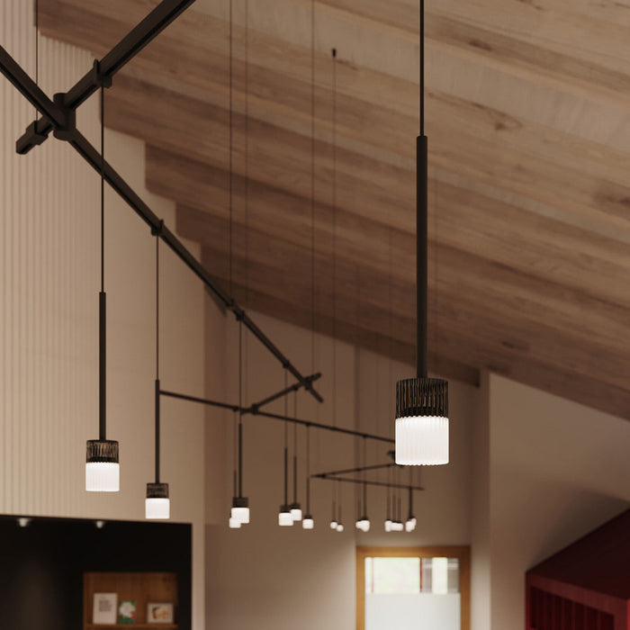 Suspenders® Zig Zag LED Pendant Light with Crystal Cylinder Luminaires in living room.