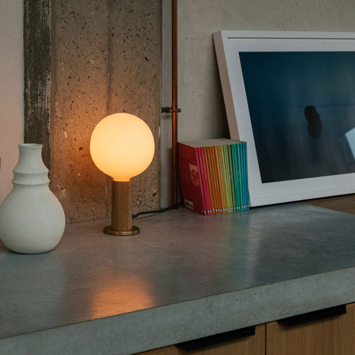Knuckle Sphere IV Table Lamp in living room.