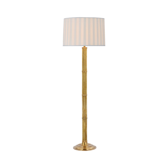 Downing Floor Lamp in Natural Brass.