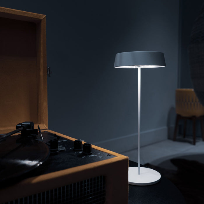 Alessandro Volta LED Portable Battery Table Lamp in living room.