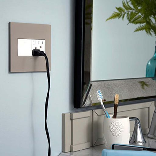 adorne® Energy-Saving On/Off Outlet in bathroom.