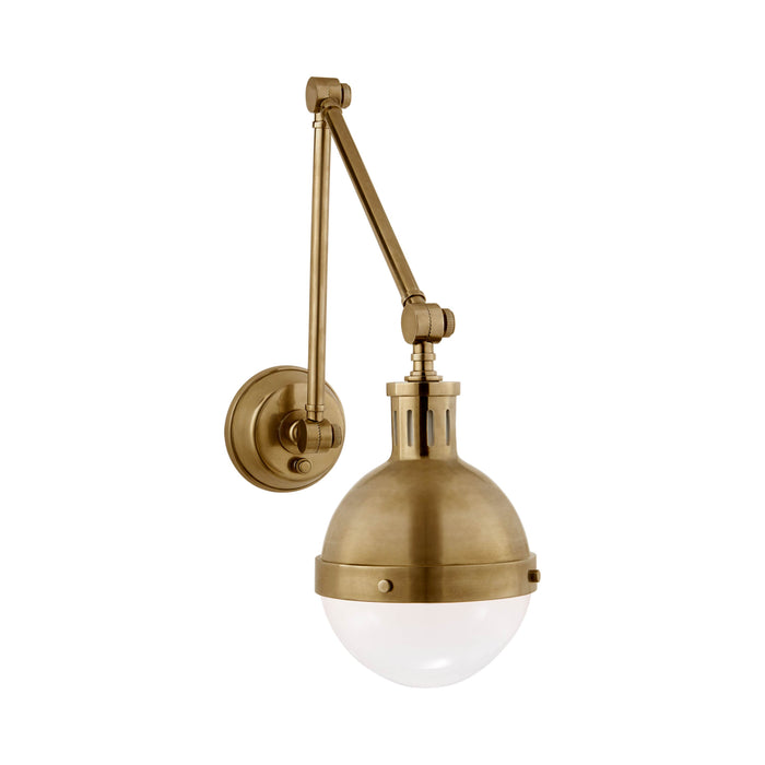 Hicks Adjustable Wall Light in Hand-Rubbed Antique Brass.